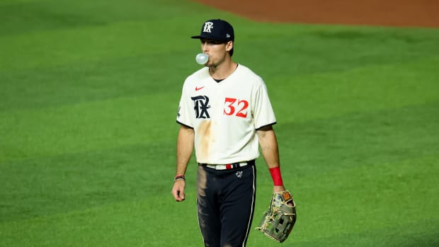 Sep 8, 2023; Arlington, Texas, USA; Texas Rangers right fielder Evan Carter (32) blows a bubble during the game against the Oakland Athletics at Globe Life Field. Mandatory Credit: Kevin Jairaj-USA TODAY Sports